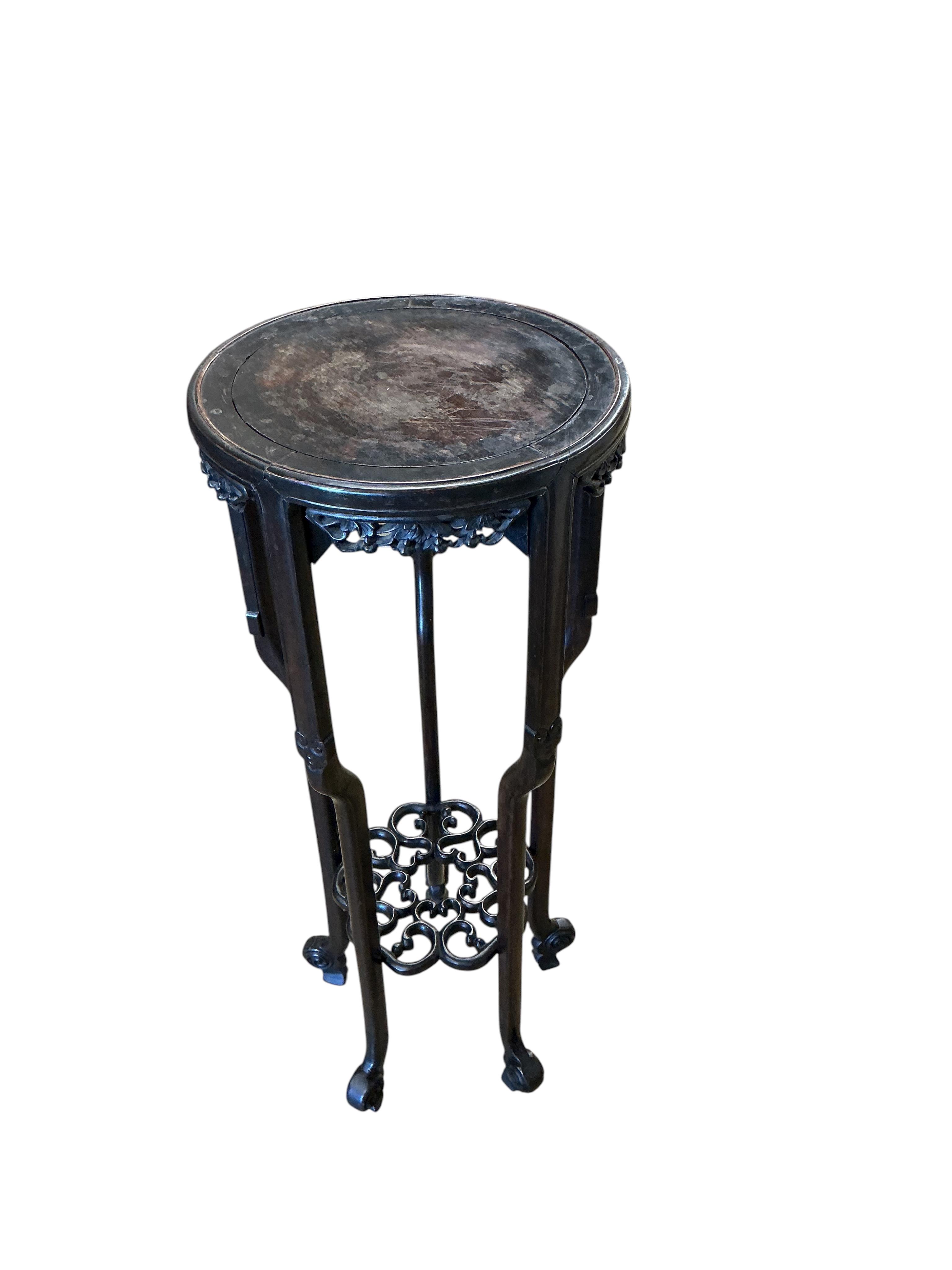 A Chinese carved hardwood vase stand, diameter 39cm, height 98cm